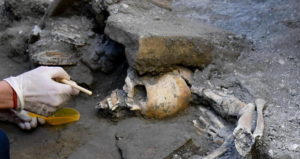 Pompeii Skull Under Rock