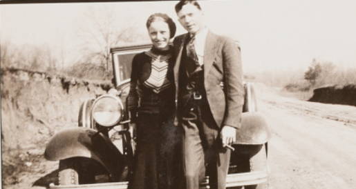Bonnie And Clyde Standing By Car