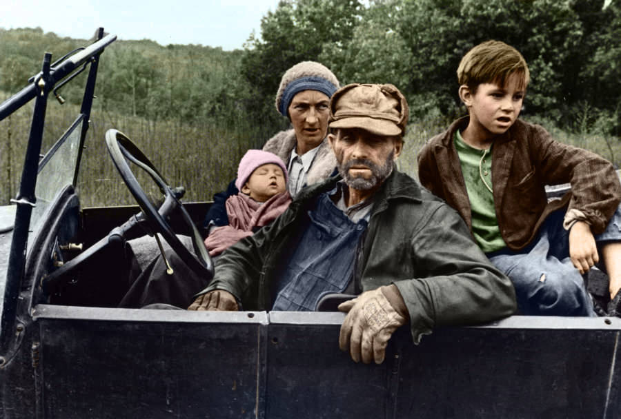 Poor Family Sitting In Car
