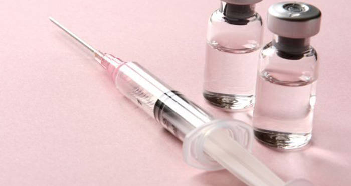 Syringe Beside Bottles