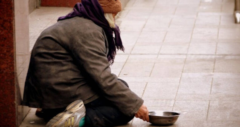 Homeless Person Begging With Bowl