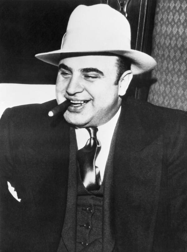 Al Capone Chomping On A Cigar And Smiling