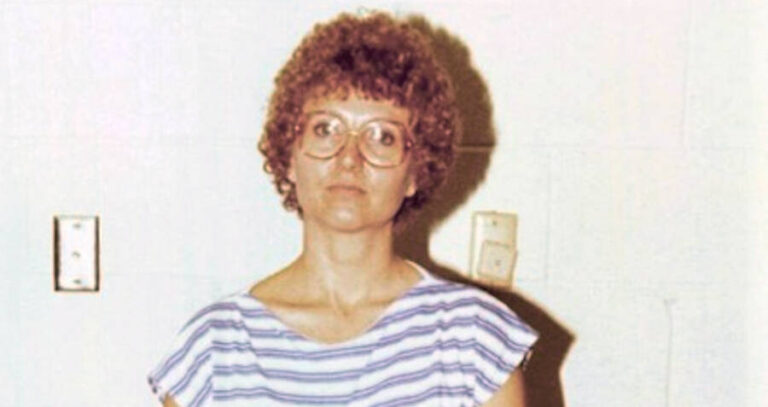 Candy Montgomery Standing Against White Wall